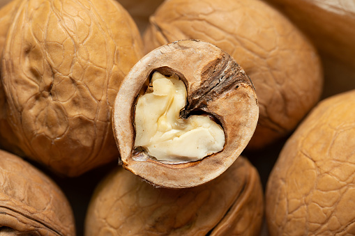 Walnut kernels close up. Half of a walnut in the shape of a heart.