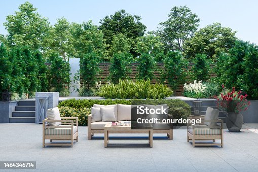 istock Modern Patio With Sofa, Armchairs, Coffee Table And Garden View Background 1464346714