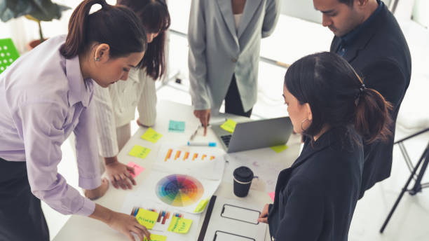 istock Business people proficiently discuss work project on meeting table . Corporate business team collaboration concept . 1464351413