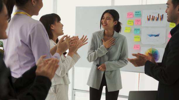 istock Businesswoman proficiently present work project receive celebrations from team . Corporate business team collaboration concept . 1464355839