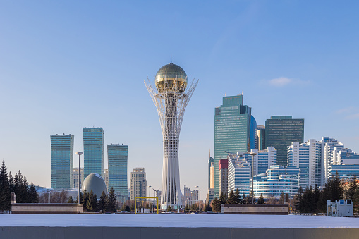 Panoramic view of Baiterek Tower on Nurjol Boulevard. Urban landscape of sunny winter day in city of Astana, Nur-Sultan, Kazakhstan.