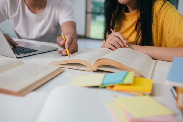 istock Close up an asian students are reading books and study, Tutoring together. 1464357519