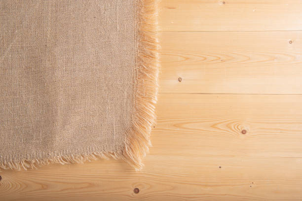 istock Rustic background with wood and sackcloth 1464357559