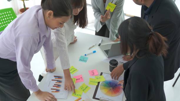 istock Business people proficiently discuss work project on meeting table . Corporate business team collaboration concept . 1464357836