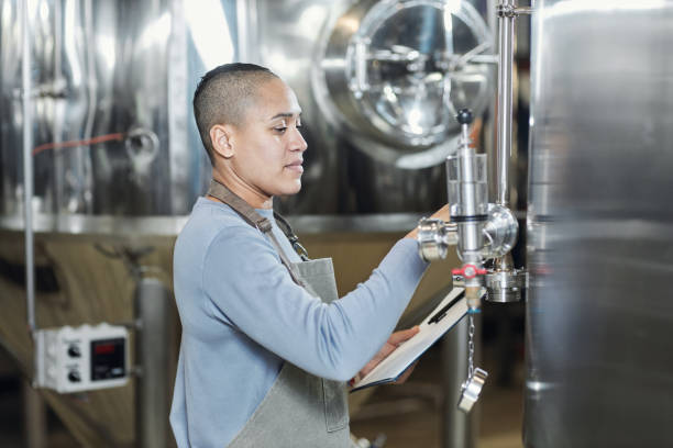 istock Side view portrait of female brewmaster 1464359251