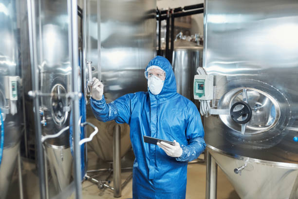istock Male worker wearing protective gear overseeing production 1464359922