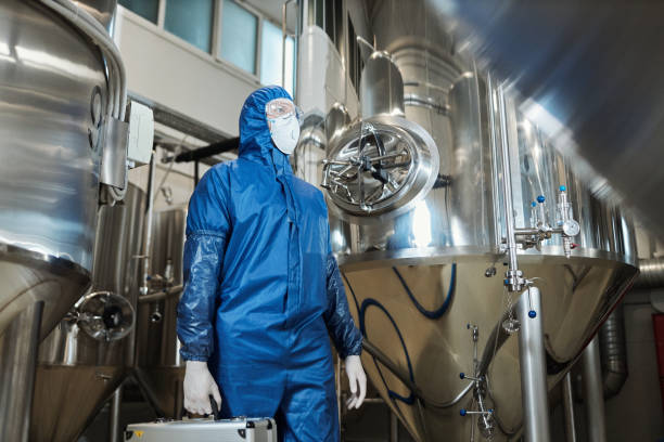istock Low angle worker wearing protective gear in chemical factory workshop 1464360143