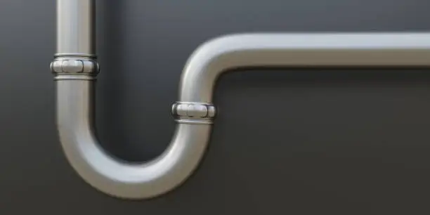 Water pipe under kitchen sink on grey wall background. Close up view of new silver siphon, stainless kitchen or bathroom plumbing tube. 3d render