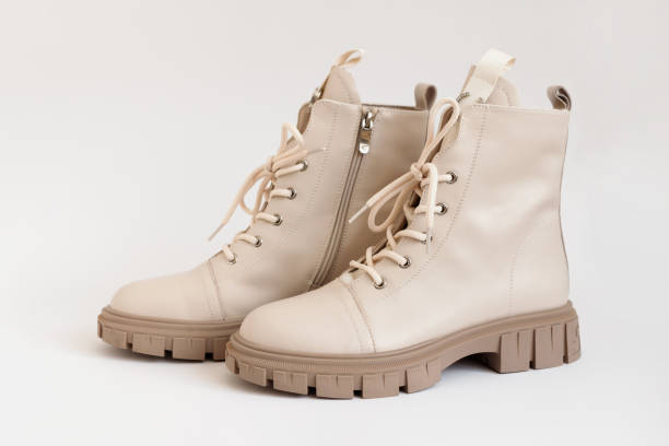istock Beige Female Fashion Boots on White Background. 1464363514