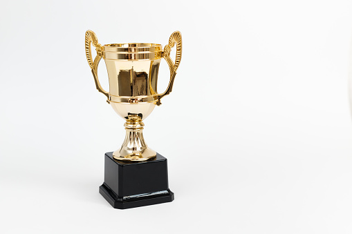 Golden Winner prize Cup on White background