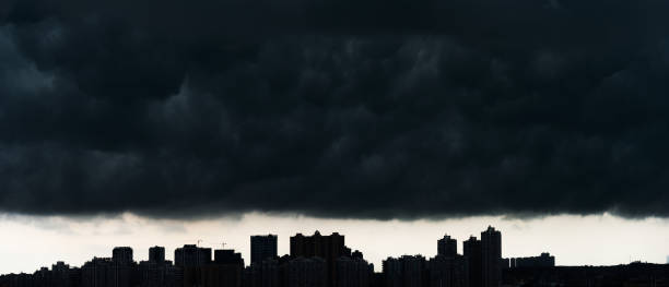 istock City under dark stormy clouds 1464364301