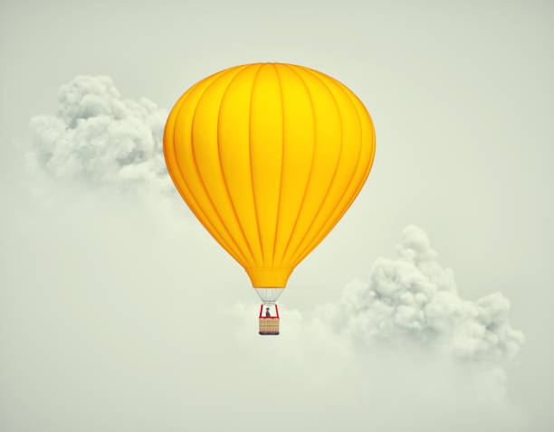 istock Hot air balloon flying above clouds. 1464364688