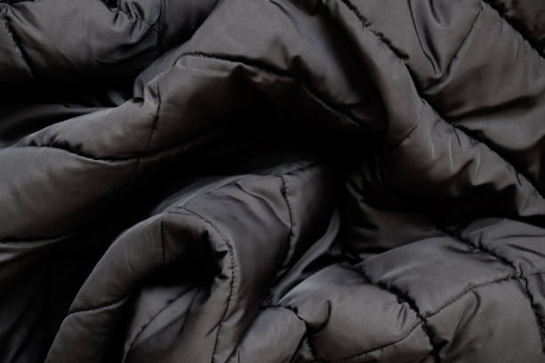 istock Black winter men's jacket as a background close-up, clothes 1464368020