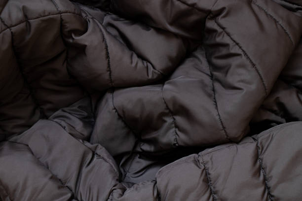 istock Black winter men's jacket as a background close-up, clothes 1464368026