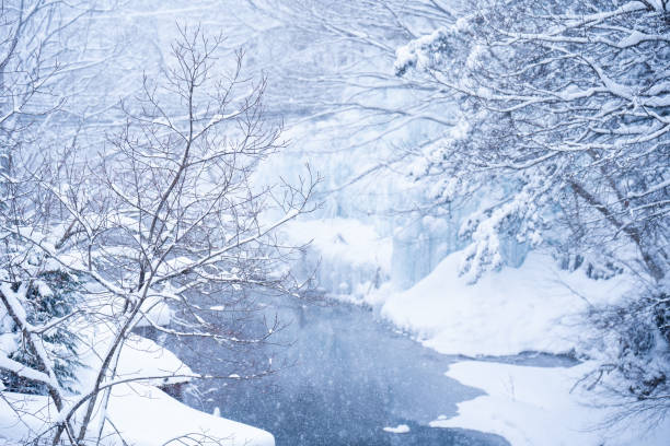 heavy snow  at the river in Heike No Sato Village in Tochigi Prefecture, Nikko City, JAPAN heavy snow  at the river in Heike No Sato Village in Tochigi Prefecture, Nikko City, JAPAN wintry landscape january december landscape stock pictures, royalty-free photos & images