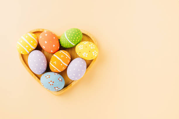 istock Overhead easter eggs in shape heart isolated on pastel background 1464368541