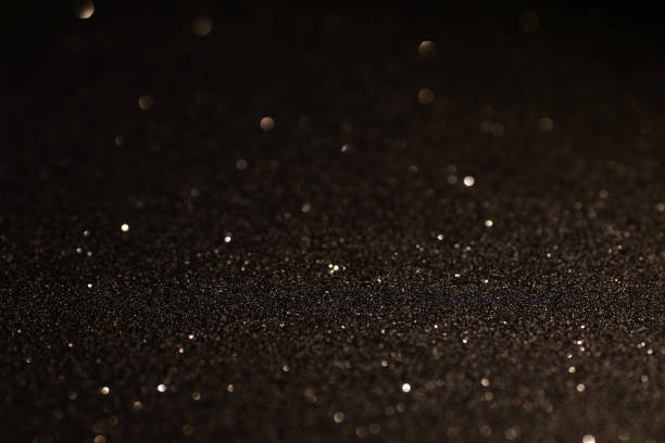 istock Black glittering background for design and free space. 1464369979