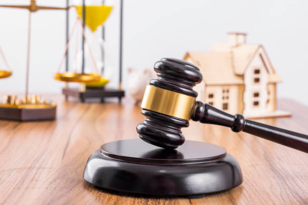 istock The scales and the judge's hammer on the table 1464371403