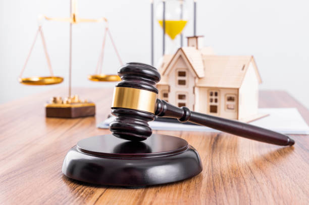istock The scales and the judge's hammer on the table 1464371416