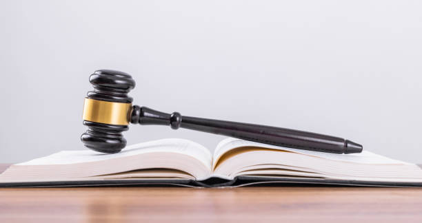 istock The scales and the judge's hammer on the table 1464371477