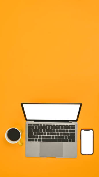 istock Mock up laptop and smart phone with empty screens on yellow background. Copy space for text information or content. 1464372579