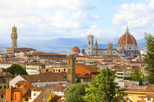 Firenze skyline viewed from piazzale michelangelo with Duomo and Palazzo Vecchio in a cloudy windy day