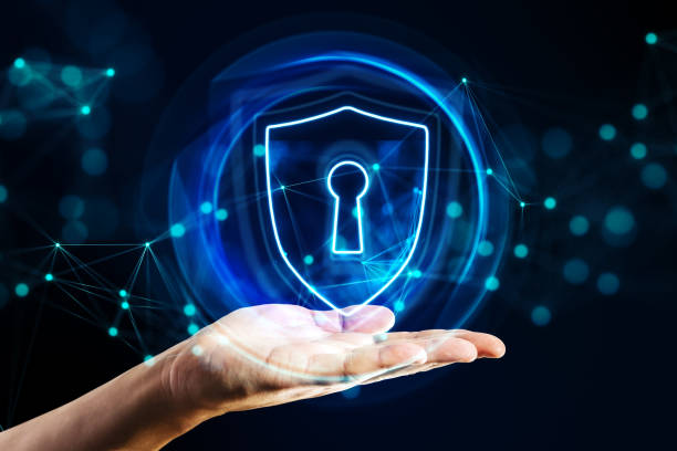 istock Cyber security and privacy concept with digital shield icon with keyhole in virtual sphere above man palm on dark background with blurred dots 1464380352