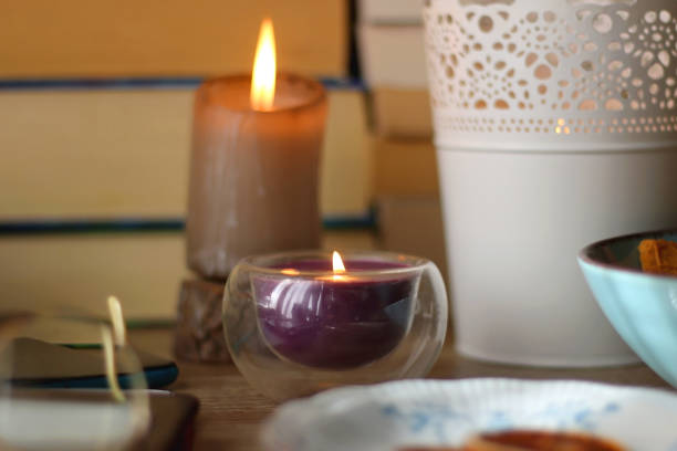 istock Notebook, Books, Tablet, Glasses, Phone, Tea, Biscuits and Candle 1464381531