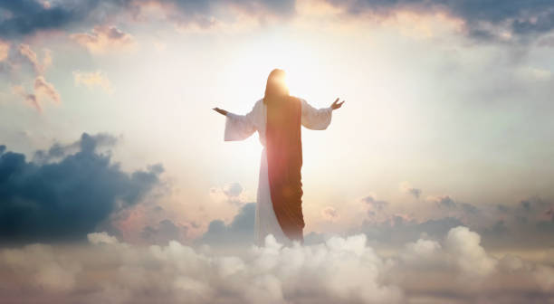resurrected jesus christ ascending above the sky and clouds, heaven concept - jesus open arms bildbanksfoton och bilder