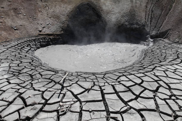 Dragons Mouth Spring View of Dragons Mouth Spring in Yellowstone National Park, Wyoming, USA. mud volcano yellowstone stock pictures, royalty-free photos & images