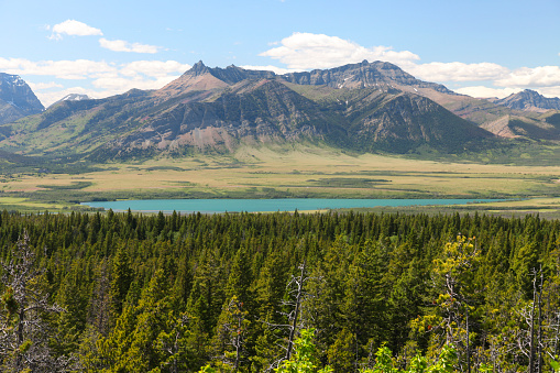 Scenic view of Waterton lake with mountain range in background, Waterton Lakes National Park, Alberta, Canada.