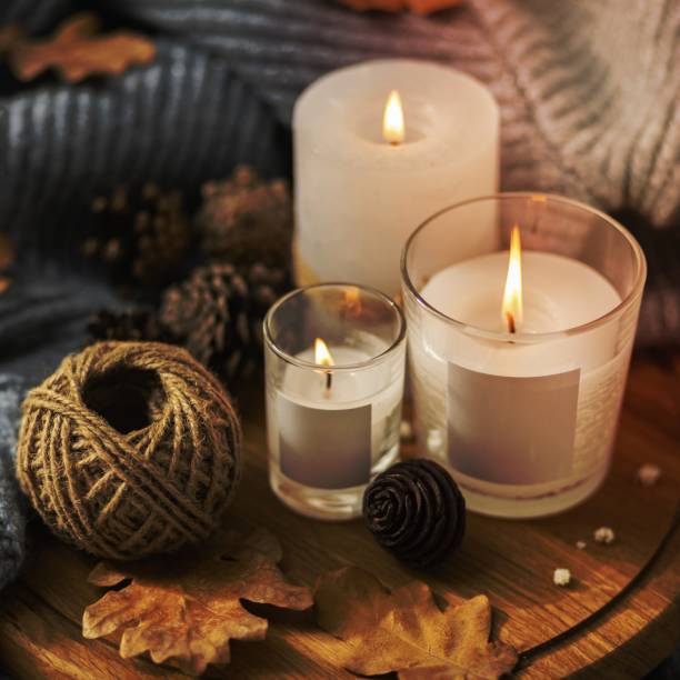 istock high angle lit candles with string pine cones. High quality beautiful photo concept 1464387170