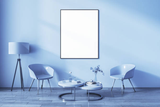 istock Front view on blank white poster in black frame on sunlit wall background in blue shades living room with vintage lamp and coffee table among glossy chairs on wooden floor. 3D rendering, mock up 1464387505