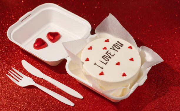 istock Small bento cake In box on the red shimmer background 1464387822