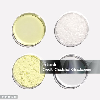 istock Poly Aluminium chloride liquid, Microcrystalline wax, Alcohol and Sulfur Powder in Petri dish. Chemical ingredient for Cosmetics and Toiletries product. Top View 1464389358