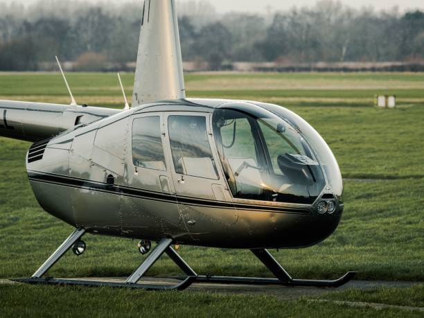 istock Training helicopter sat on the ground at the airfield 1464390874