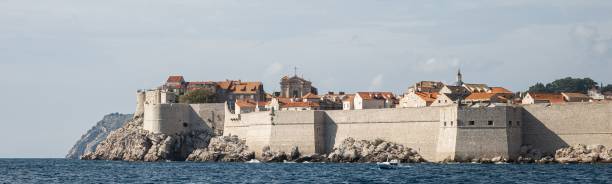 City walls of Dubrovnik seen from the Adriatic Sea. Croatia. The city walls of Dubrovnik seen from the Adriatic Sea. Croatia. dubrovnik walls stock pictures, royalty-free photos & images