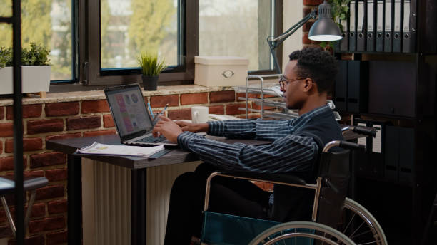istock African american worker with chronic disability using laptop 1464392703