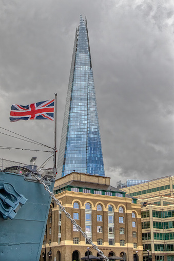 It took 3 years to build and turned out to be the tallest building in the United Kingdom. The Shard in the background. London, United Kingdom.