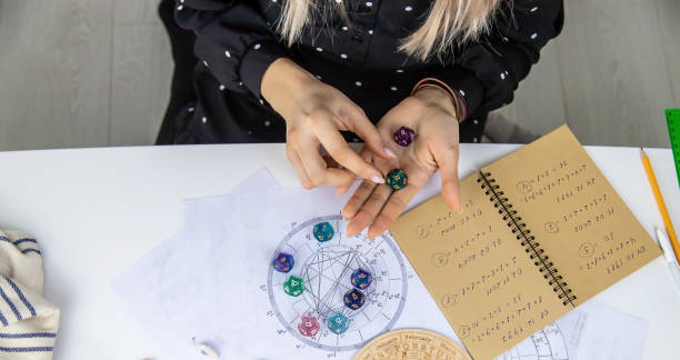istock Woman numerologist astrologer counts numbers. Selective focus. 1464398445