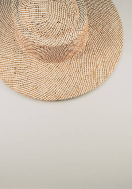 istock Vertical shot of a straw hat on a white surface 1464402000