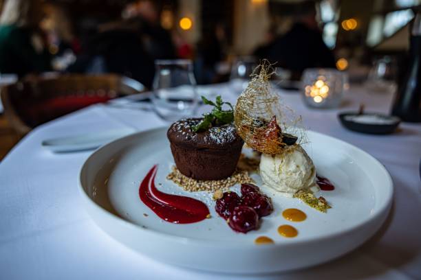 istock Molten chocolate cake with ice cream on a white table 1464402090