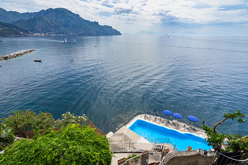A charming swimming pool overlooking on the Mediterranean Sea in Amalfi, Italy