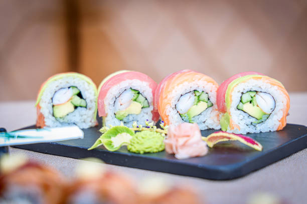 istock Colorful sushi rolls on the table with a blurred background 1464402479