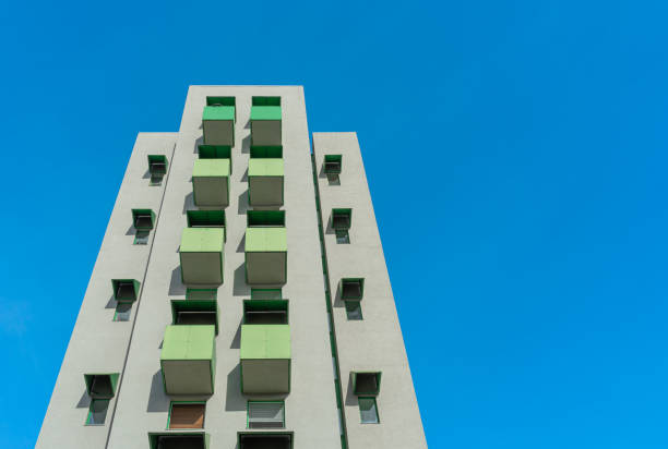 istock Low angle view of building against clear blue sky 1464403576