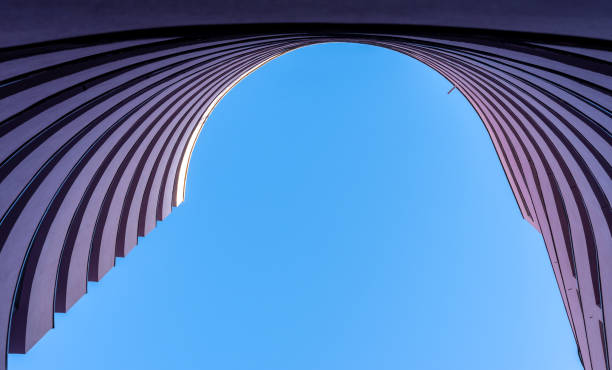 istock Low angle view of building against clear blue sky 1464403645