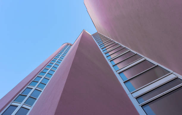 istock Low angle view of building against clear blue sky 1464403750