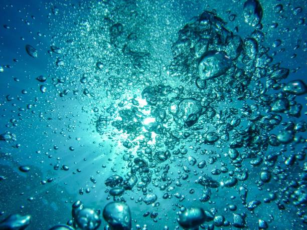 istock some bubbles are being photographed in a blue ocean setting in the sun 1464403992