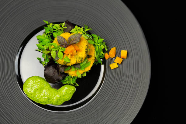 istock Top view of pumpkin chops with quinoa on a black plate 1464405088