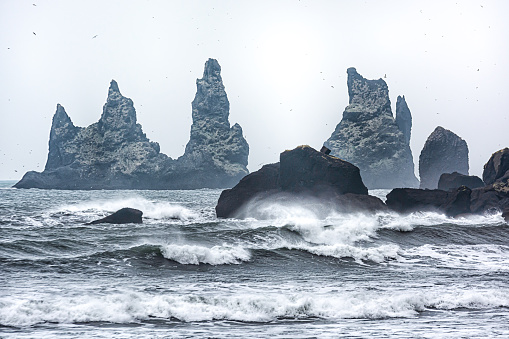 A scenic view of strong waves at the Reynisdrangar Vik beach in Iceland